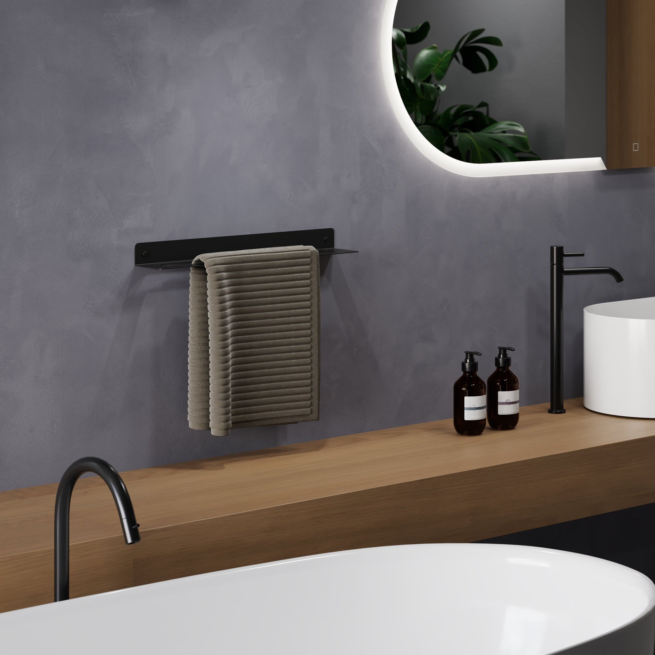 20" black powder-coated steel towel rack positioned in the middle
