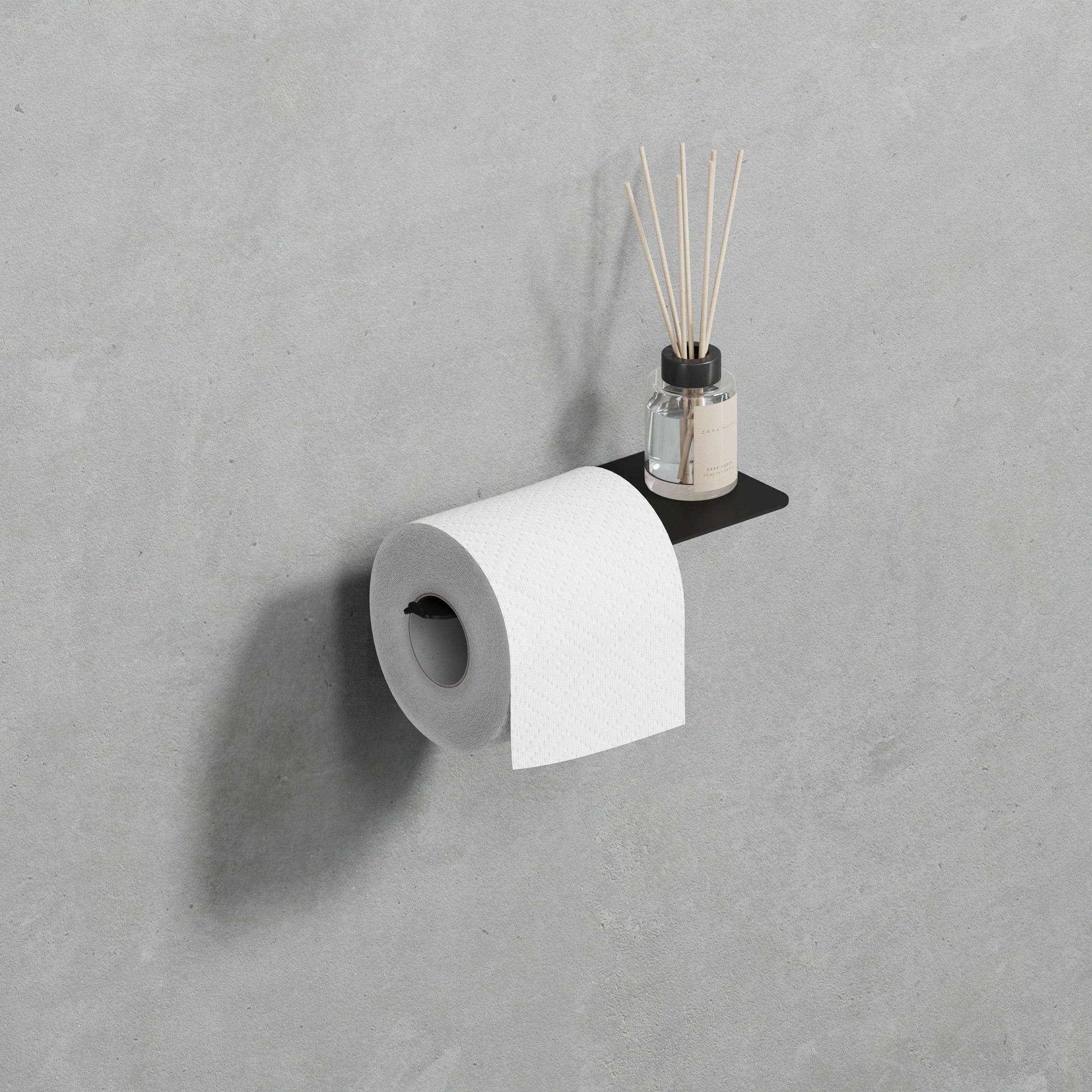 black steel toilet paper holder mounted on a bathroom wall, providing a modern touch to the space