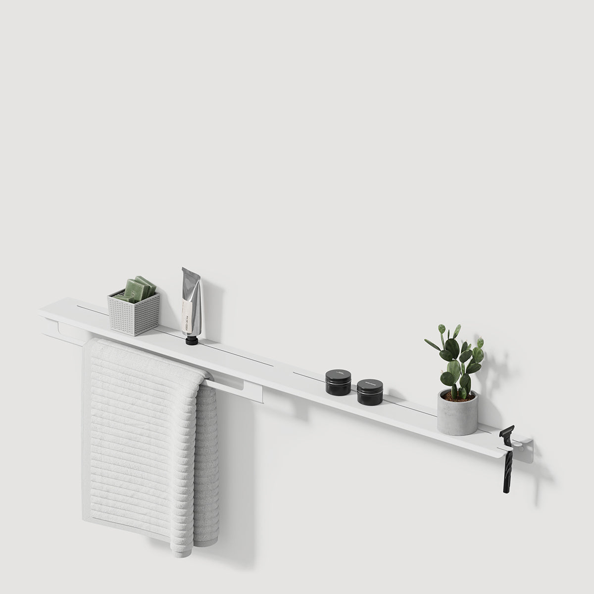 white bathroom shelf with towel holder