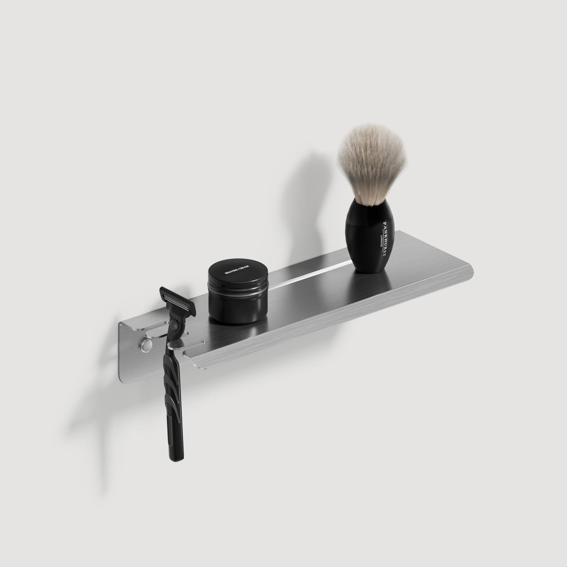 Brushed steel shower shelf with razor