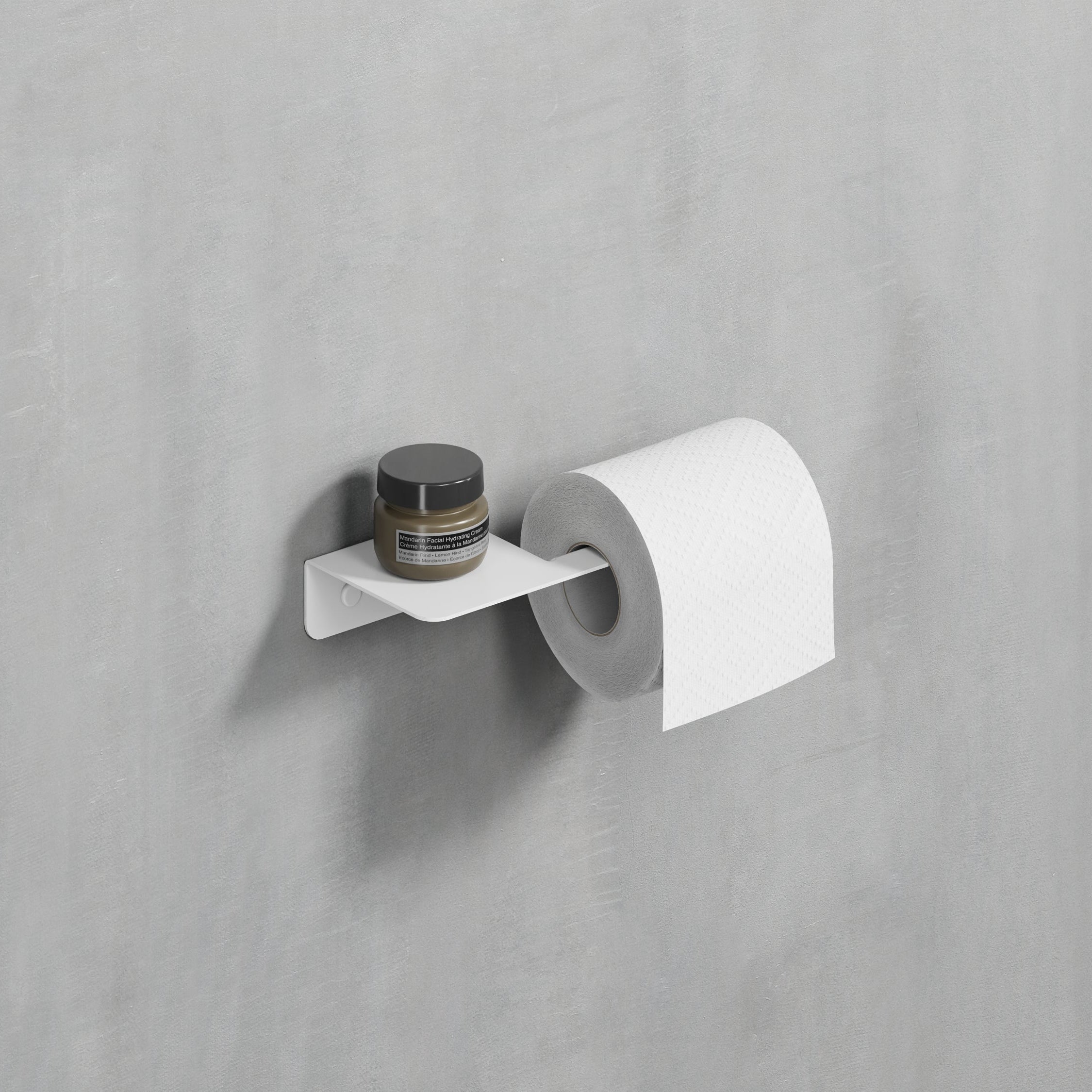 Clean white steel toilet paper holder installed on a bathroom wall, offering a fresh and airy feel